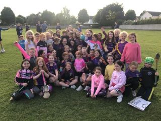 Camogie Féile winning team bring Cup to U9 training.