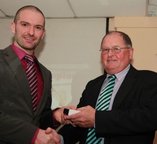 Senior medal presentation by Sean Shanley to Niall Curtin