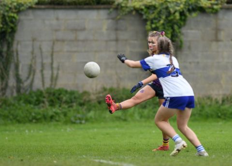 Vincents player trying to block a kick