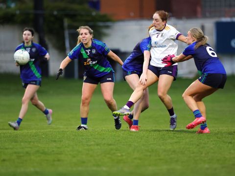 Kate Murray gets a kick away under pressure