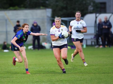 Crokes no 14 protects ball under pressure from Sylvesters player tackling her