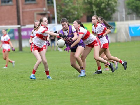 Kilmacud goalkeeper moving away from tackle