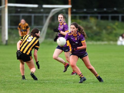 Kilmacud no 6 carries the ball past a tackle